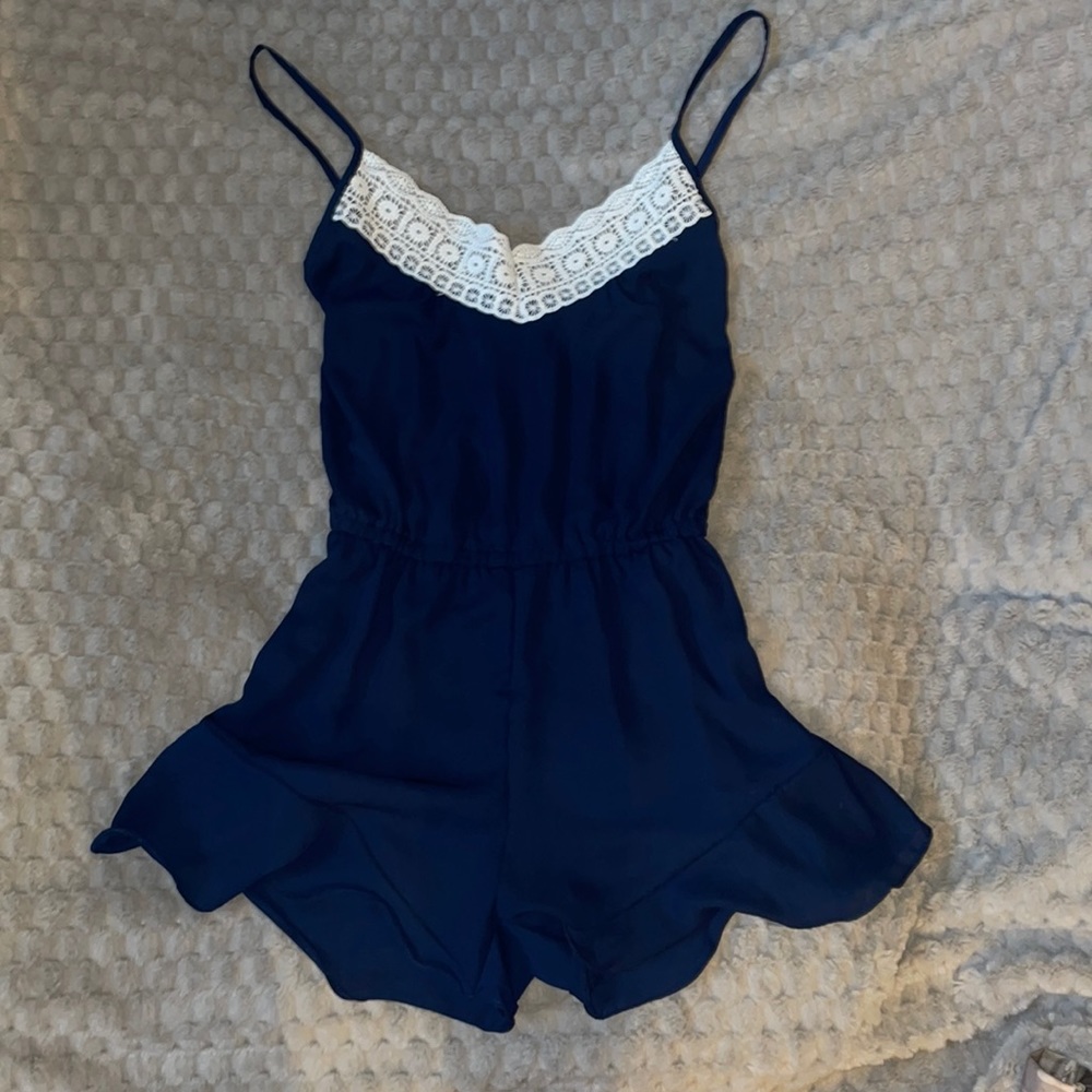 Lingerie dark blue romper with white lace at the top, also has pockets.